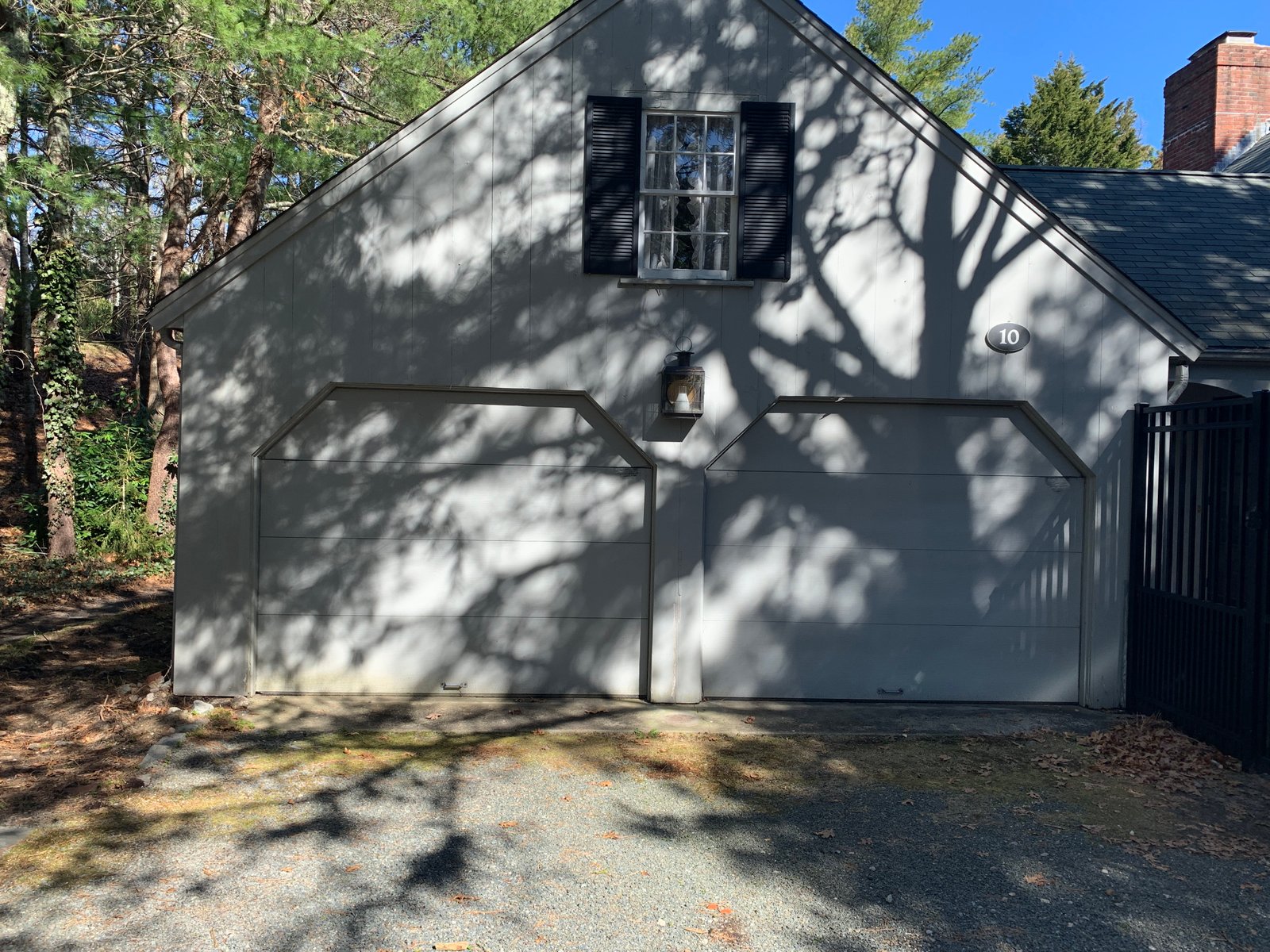 After: Modern Garage Door & Siding Refresh: Contemporary Elegance